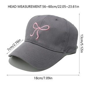 Detailed size chart for grey baseball cap with pink embroidered bow and cotton texture