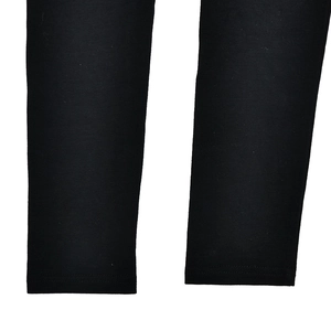 Close-up of the stitching process and fabric texture on the black slim-fit T-shirt cuff