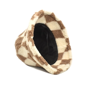 Detail shot of the thick faux lamb wool texture and brown checkerboard pattern bucket hat