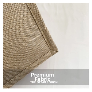 Macro shot of durable linen fabric texture and precise stitching on a large tote bag