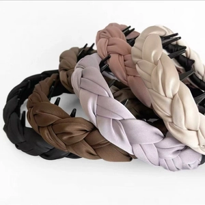 Close-up of padded satin headbands in five colors with non-slip interior teeth