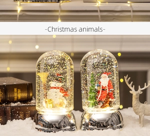 Luminous Christmas snow globe lantern with Santa Claus and snowman festive holiday decor