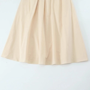 Beige poplin midi dress with a flowing A-line silhouette and refined woven texture