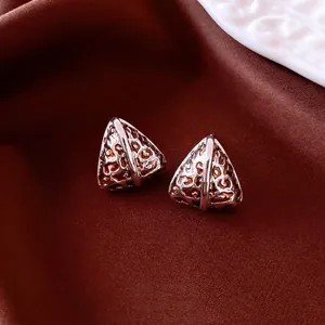 Triangle leopard print hollow 14K gold plated earrings on elegant red silk fabric