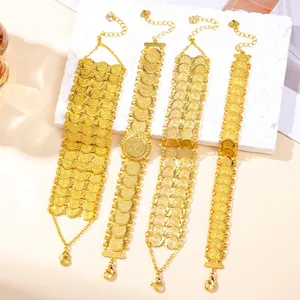 Bohemian gold coin link bracelet with intricate embossed texture and heart pendant charm