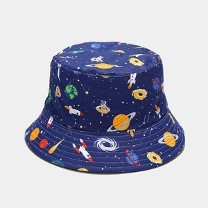 Dark blue reversible bucket hat with colorful cosmic planet and rocket galaxy prints