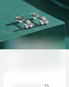 Macro shot of 925 sterling silver clover stud earrings featuring hand-set 5A cubic zirconia