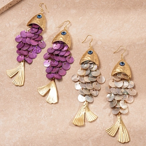 Elegant gold fish-shaped earrings with shell scales and evil eye accents in purple and white