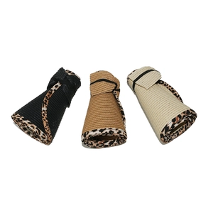 Three colors of foldable paper straw sun visors with leopard print trim detailing