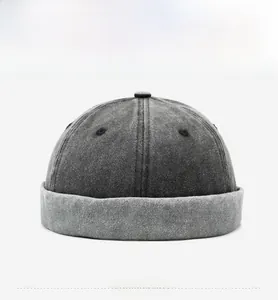 Front view of a dark grey washed cotton docker hat with a vintage distressed finish