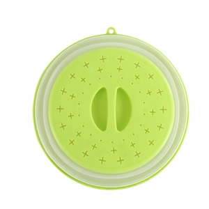 Collapsible green silicone microwave splatter cover with steam vents and easy-grip handle