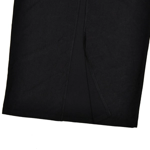 Detailed close-up of premium black woven fabric texture and seamless hem stitching
