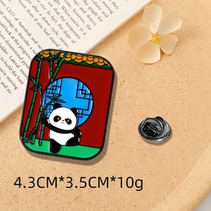 Detail view of 4.3x3.5cm panda enamel pin with bamboo and Chinese window design