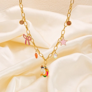 Detail of gold chunky necklace featuring rainbow unicorn and colorful butterfly charms