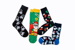 Detail of cotton knit socks featuring pug, Santa, snowman and Christmas stocking patterns