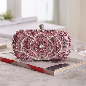 Exquisite pink satin evening clutch bag with intricate beads and floral pearl details