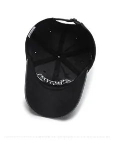 Detail view of washed denim baseball cap interior with adjustable bronze buckle and stitching