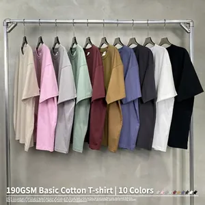 Oversized 190G heavy cotton t-shirts in 10 solid colors on a metal rack
