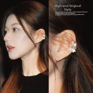 Detailed close-up of a floral ear cuff with gradient petals and shimmering zircon stones