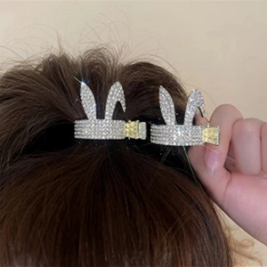 Detail of silver bunny ear hair claw clip with rhinestones for ponytail styling