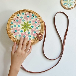 Handmade round rattan bag with colorful shell mosaic and brown leather strap