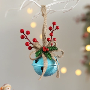 Close-up of sky blue bell with red berries and bow on a white branch decoration