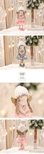 Detailed view of handmade Christmas angel doll ornaments with lace wings and plush details
