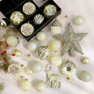 Mint green and champagne Christmas ball ornaments set with glitter stars and deer