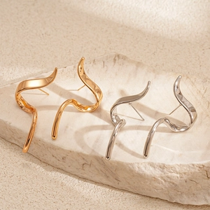 Modern minimalist irregular geometric wave earrings in polished gold and silver finish
