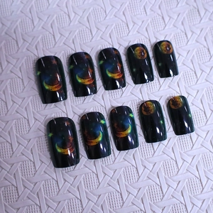 Star and moon pattern press-on nails in black glossy finish with square-oval shape
