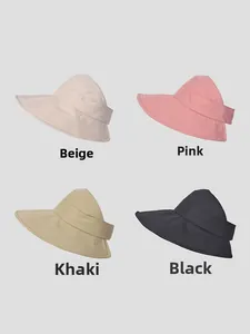 Detail view of four-color sun visors in beige, pink, khaki, and black with wide brims