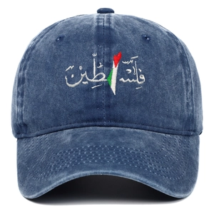 Detail of Palestine embroidery on washed navy blue cotton baseball cap with textured finish
