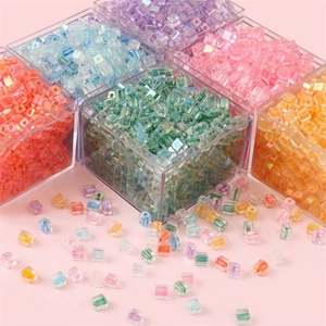Colorful 5mm square glass seed beads in acrylic storage boxes for DIY jewelry making
