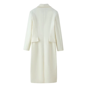 Back view detail of a long-sleeved wool coat showing clean lines and waist tailoring