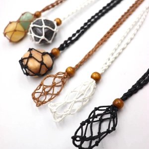 Detail view of handmade braided necklace cord with adjustable mesh pouch and dark wood beads