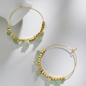 Detailed view of 14k gold plated hoop earrings with green natural stone and square beads