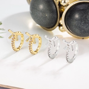 Elegant S925 sterling silver bow knot earrings with cubic zirconia in gold and silver