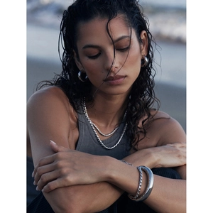 Silver stainless steel jewelry set featuring layered chain necklaces and cuff bracelets