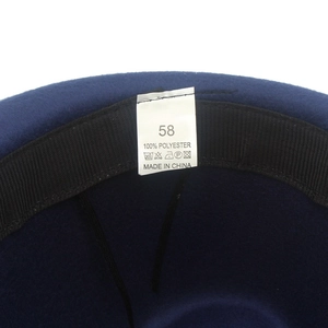 Detailed view of hat interior showing 100% polyester fabric label and size 58 tag