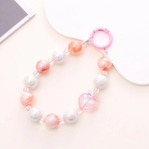 Handmade pink and white beaded phone strap with a heart pendant and round clasp