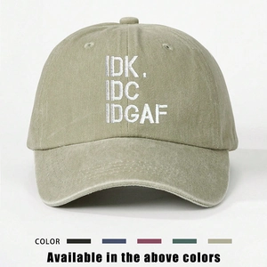 Detail of embroidered IDK IDC IDGAF text on adjustable washed khaki cotton baseball cap