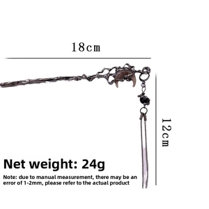 Detail of dark moon hair stick showing 18cm main length and 12cm tassel dimensions
