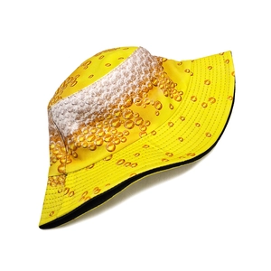 Yellow bucket hat featuring white beer foam pattern for outdoor summer travel protection