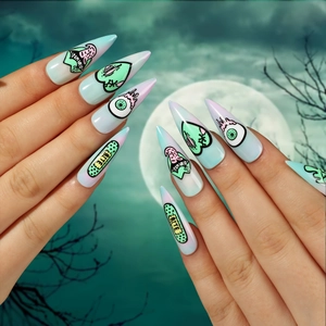 Stiletto press-on nails with Halloween eye and heart art in mint green and pink gradients
