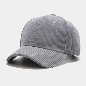 Close-up of classic six-panel grey corduroy baseball cap showing fine fabric texture