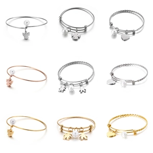 Adjustable woven stainless steel bracelets with pearl charms in gold, silver, and rose gold