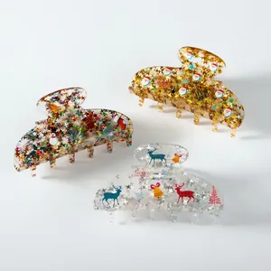 Three large acrylic Christmas hair claws with glitter sequins and festive patterns