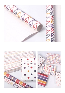 Detail of colorful heart and star pattern gift wrap rolls and wrapped birthday boxes