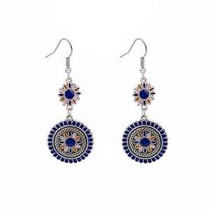 Bohemian silver drop earrings with blue enamel mandala flower pattern on white background