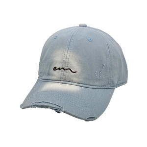 Vintage light blue distressed denim baseball cap with EM embroidery and ripped detailing